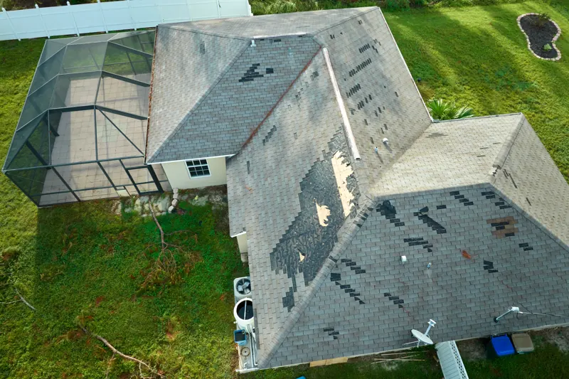 Drone view of a roof with missing shingles