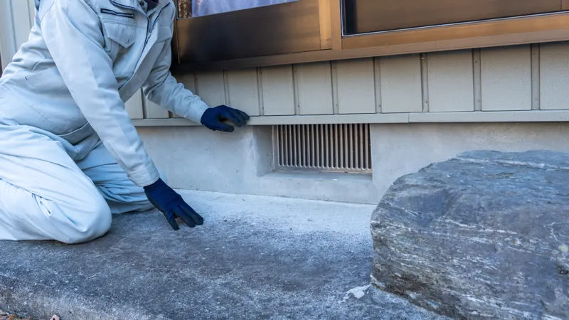 Inspector checking a home's foundation